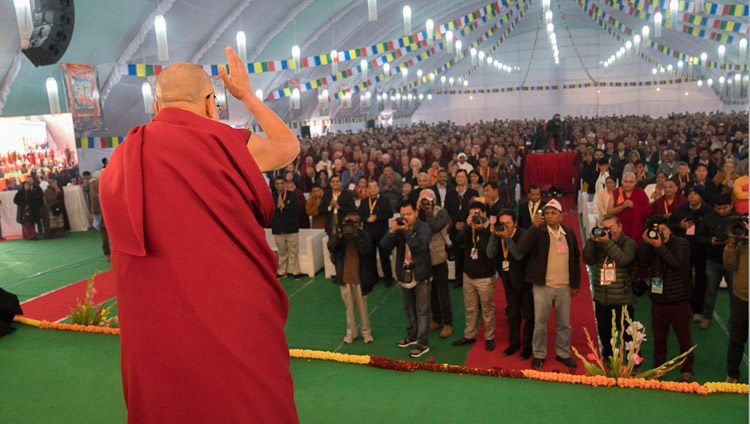 His Holiness the Dalai Lama waving to the audience on his arrival at the venue for the conference on Mind in Indian Philosophical Schools of Thought and Modern Science at the Central Institute of Higher Tibetan Studies in Sarnath, Varanasi, India on December 30, 2017. Photo by Lobsang Tsering