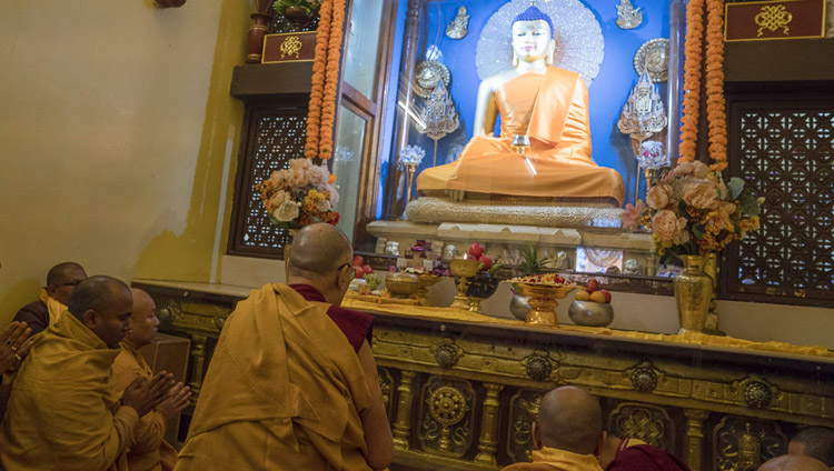 His Holiness the Dalai Lama leading recitations of prayers and praises in front of the Buddha statue inside the Mahabodhi Temple in Bodhgaya, Bihar, India on January 2, 2018. Photo by Tenzin Choejor