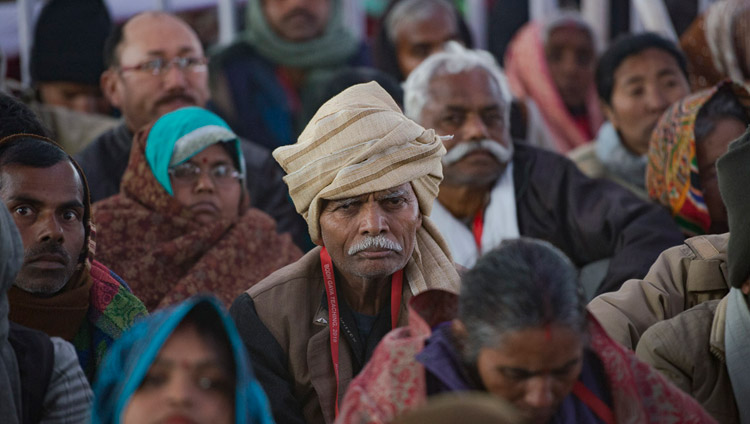 Members of the crowd listening to His Holiness the Dalai Lama on the first day of his teachings requested by Indian Buddhists at the Kalachakra Maidan in Bodhgaya, Bihar, India on January 5, 2018. Photo by Lobsang Tsering