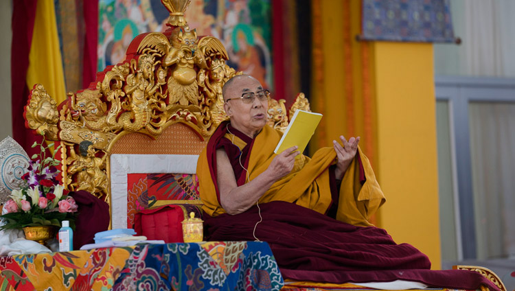 His Holiness the Dalai Lama reading from the text during his teaching at the Kalachakra Maidan in Bodhgaya, Bihar, India on January 14, 2018. Photo by Lobsang Tsering