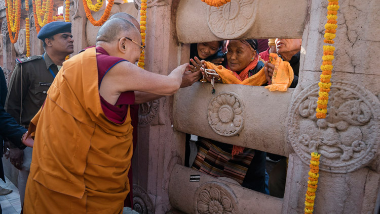 His Holiness the Dalai Lama greeting pilgrims during his visit to the Mahabodhi Stupa in Bodhgaya, Bihar, India on January 28, 2018. Photo by Tenzin Choejor