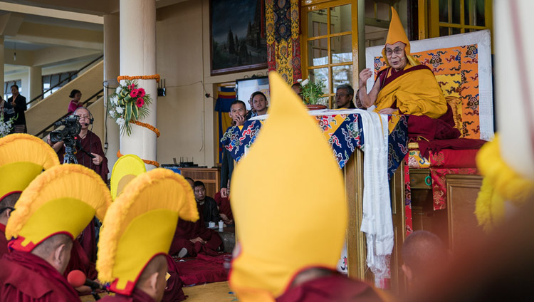 His Holiness the Dalai Lama joining in closing prayers at the conclusion of his teachings on the Day of Miracles at the Main Tibetan Temple courtyard in Dharamsala, HP, India on March 2, 2018. Photo by Tenzin Choejor