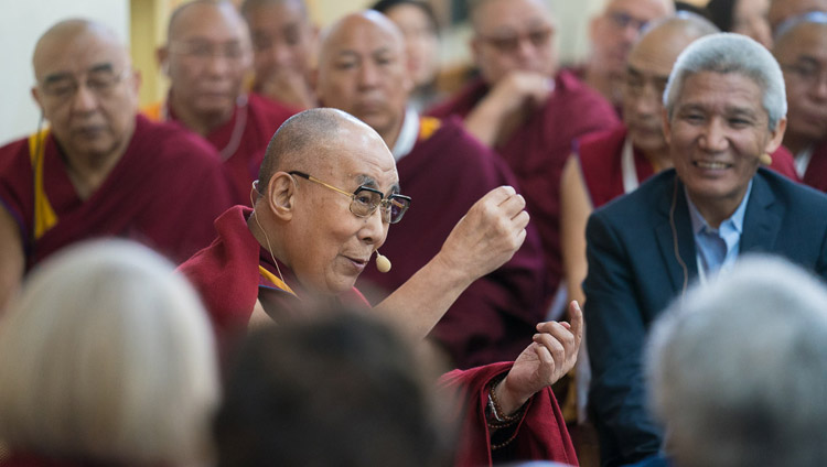 His Holiness the Dalai Lama speaking at the end of the second day of the 33rd Mind & Life Conference - Reimagining Human Flourishing - at the Main Tibetan Temple in Dharamsala, HP, India on March 13, 2018. Photo by Tenzin Choejor His Holiness the Dalai Lama speaking at the end of the second day of the 33rd Mind & Life Conference - Reimagining Human Flourishing - at the Main Tibetan Temple in Dharamsala, HP, India on March 13, 2018. Photo by Tenzin Choejor