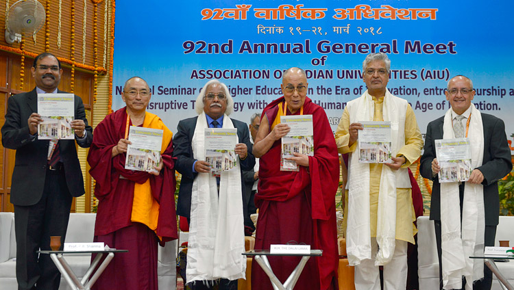 His Holiness the Dalai Lama and participants releasing the AIU Annual Report at the 92nd Annual Meet of Association of Indian Universities at CIHTS in Sarnath, UP, India on March 19, 2018. Photo by Lobsang Tsering