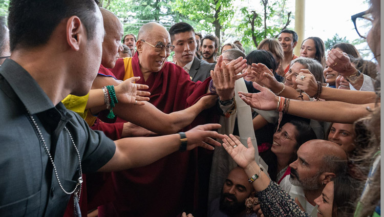 His Holiness the Dalai Lama greeting members of the more than 1500 strong crowd gathered in the Main Tibetan Temple courtyard to listen to his talk in Dharamsala, HP, India on April 16, 2018. Photo by Tenzin Choejor