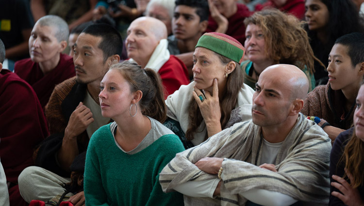Members of the crowd listening to His Holiness the Dalai Lama during his talk to visitors from India and abroad at the Main Tibetan Temple courtyard in Dharamsala, HP, India on April 16, 2018. Photo by Tenzin Choejor