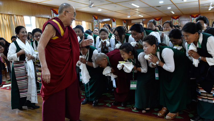 His Holiness the Dalai Lama greeting members of the Tibetan Women's Association as he arrives for their meeting at his residence in Dharamsala, HP, India on May 14, 2018. Photo by Ven Tenzin Damchoe