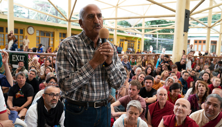 A member of the audience asking His Holiness the Dalai Lama a question during his meeting with visitors from around the world at the Tsuglagkhang courtyard in Dharamsala, HP, India on May 19, 2018. Photo by Tenzin Choejor