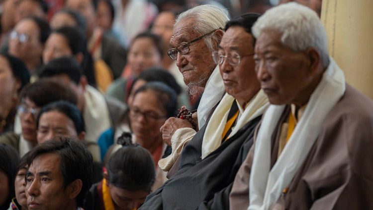 Participants to an International Conference on the Middle Way Approach listening to His Holiness the Dalai Lama during their meeting at the Main Tibetan Temple courtyard in Dharamsala, HP, India on May 30, 2018. Photo by Tenzin Choejor