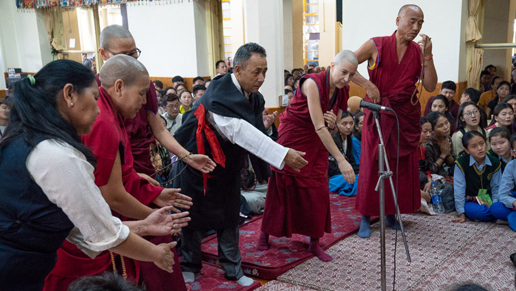 Members of the Dharamsala Buddhist Study Group demonstrating their debating skills at the start of His Holiness the Dalai Lama's teaching for young Tibetan students at the Main Tibetan Temple in  Dharamsala, HP, India on June 6, 2018. Photo by Tenzin Phuntsok