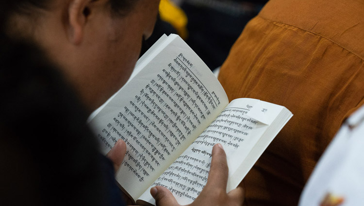 A member of the audience following His Holiness the Dalai Lama's teaching on ‘Guide to the Bodhisattva’s Way of Life’ at the Main Tibetan Temple in Dharamsala, HP, India on June 6, 2018. Photo by Tenzin Phuntsok