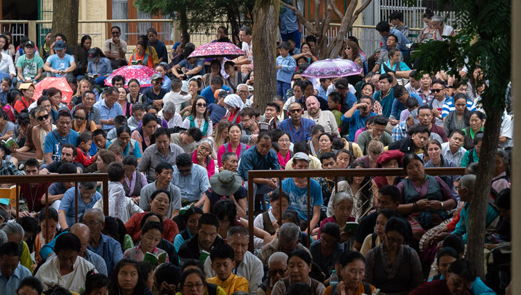 Some of the more than 9000 people attending His Holiness the Dalai Lama's teaching for young Tibetan students sitting in the Main Tibetan Temple courtyard in Dharamsala, HP, India on June 7, 2018. Photo by Tenzin Phuntsok