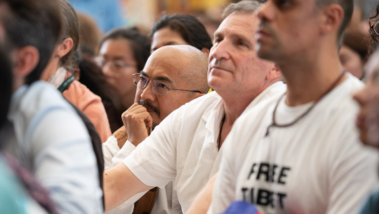 Members of the audience listening to His Holiness the Dalai Lama during his meeting with visitors from India and abroad at the Main Tibetan Temple courtyard in Dharamsala, HP, India on June 9, 2018. Photo by Tenzin Choejor Members of the audience listening to His Holiness the Dalai Lama during his meeting with visitors from India and abroad at the Main Tibetan Temple courtyard in Dharamsala, HP, India on June 9, 2018. Photo by Tenzin Choejor