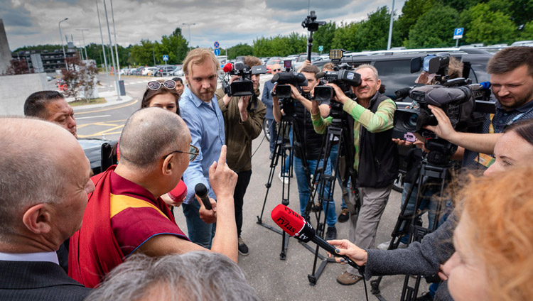 His Holiness the Dalai Lama answering questions from journalists at the airport in Vilnius, Lithuania on June 12, 2018. Photo by Tenzin Choejor