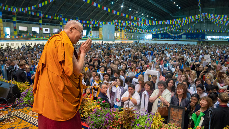 His Holiness the Dalai Lama greeting the audience on his arrival on stage at Skonto Hall in Riga, Latvia on June 16, 2018. Photo by Tenzin Choejor