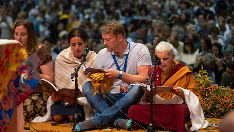 A group from Latvia reciting the ‘Heart Sutra’ in Latvian at the start of His Holiness the Dalai Lama's teaching in Riga, Latvia on June 16, 2018. Photo by Tenzin Choejor