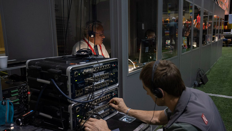 A technician keeping track of the FM transmission of the language translations during the second day of His Holiness the Dalai Lama's teaching in Riga, Latvia on June 17, 2018. Photo by Tenzin Choejor