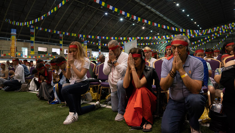 Members of the audience wearing ritual blindfolds taking part in the Avalokiteshvara Empowerment given by His Holiness the Dalai Lama in Riga, Latvia on June 18, 2018. Photo by Tenzin Choejor