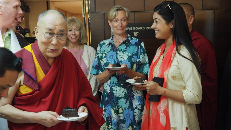 His Holiness the Dalai Lama sharing a birthday cake presented in honor of his upcoming 83rd birthday after his interview for Dutch TV in New Delhi, India on July 2, 2018. Photo by Jeremy Russell