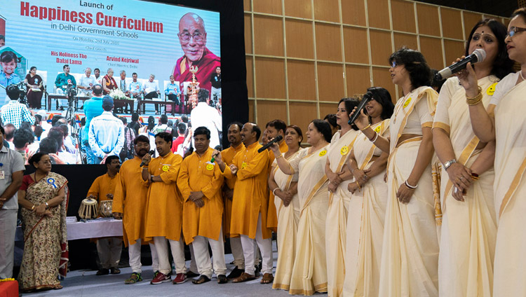 A group of teachers singing a welcome song that they composed themselves at the start of the Launch of the Happiness Curriculum in Delhi Government Schools in New Delhi, India on July 2, 2018. Photo by Tenzin Choejor