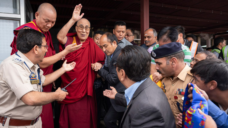 His Holiness the Dalai Lama waving to well-wishers on his arrival at the airport in Leh, Ladakh, J&K, India on July 3, 2018. Photo by Tenzin Choejor