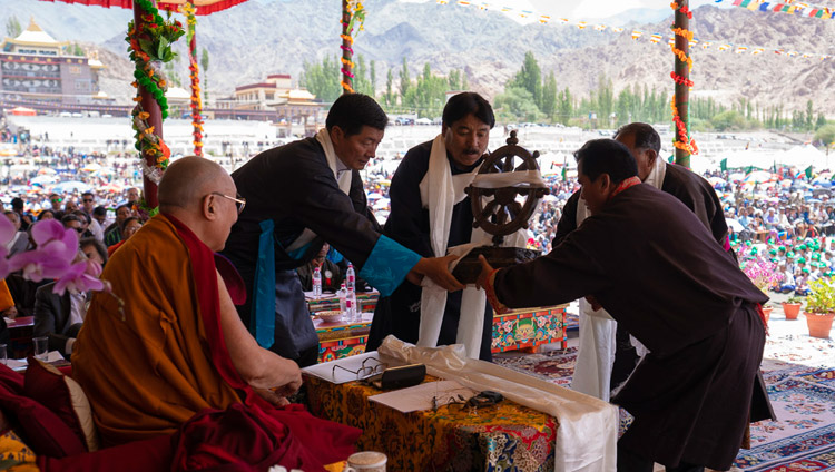 Tibetan residents of Leh and Changthang presenting His Holiness the Dalai Lama a Wheel of Dharma during celebrations on his 83rd birthday in Leh, Ladakh, J&K, India on July 6, 2018. Photo by Tenzin Choejo