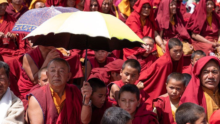 Members of the crowd of over 25000 listening to His Holiness the Dalai speaking during  celebrations on his 83rd birthday in Leh, Ladakh, J&K, India on July 6, 2018. Photo by Tenzin Choejor