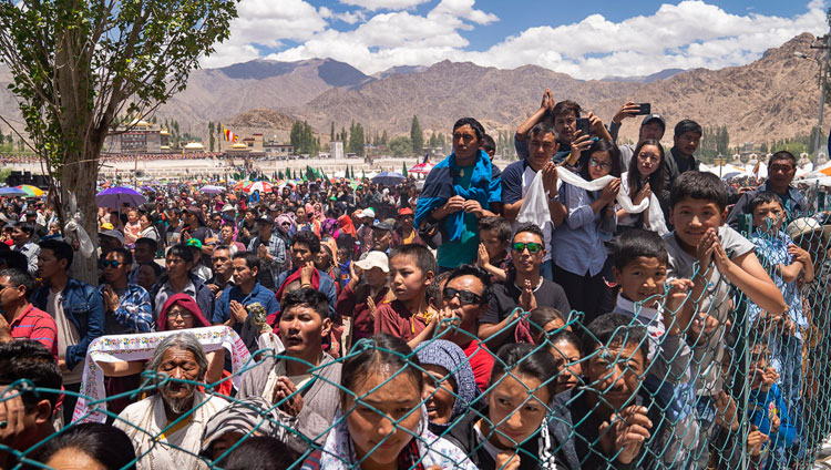 Members of the crowd line the road hoping to catch a glimpse of His Holiness the Dalai Lama as he returns to his residence at the conclusion of celebrations on his 83rd birthday in Leh, Ladakh, J&K, India on July 6, 2018. Photo by Tenzin Choejor