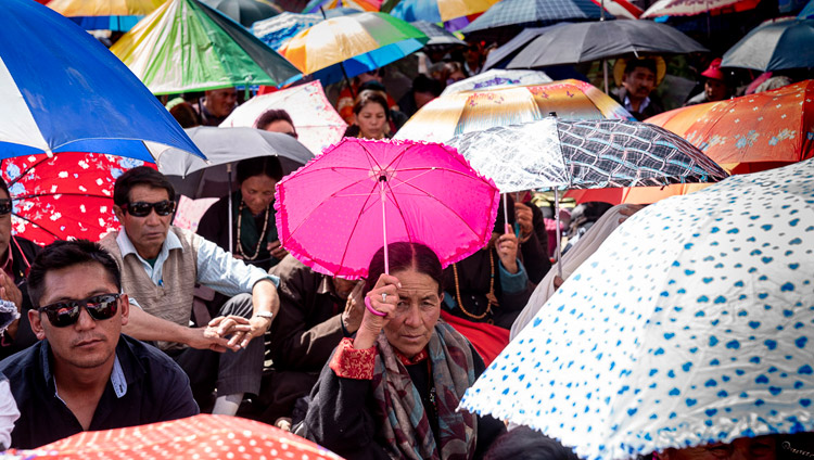 Members of the audience raising umbrellas against the sun during His Holiness the Dalai Lama's teaching in Diskit, Nubra Valley, J&K, India on July 13, 2018. Photo by Tenzin Choejor