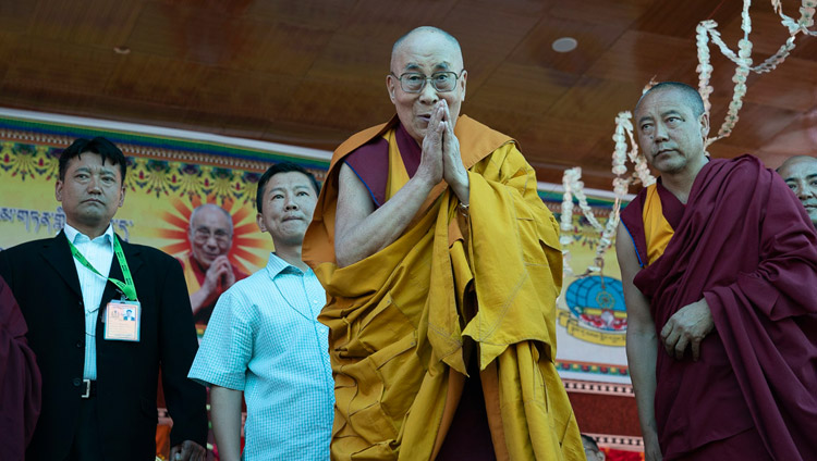 His Holiness the Dalai Lama greeting the audience as he arrives on stage at the teaching ground at Samstanling Monastery in Sumur, Nubra Valley, Ladakh, J&K, India on July 16, 2018. Photo by Tenzin Choejor