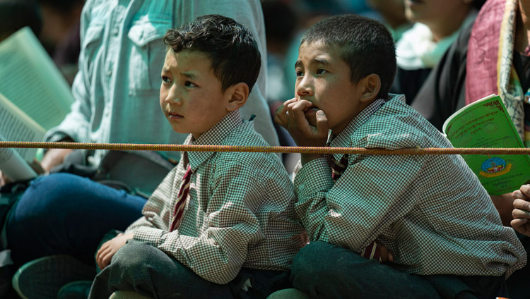 Young students listening to His Holiness the Dalai Lama during his teaching at Samstanling Monastery in Sumur, Nubra Valley, Ladakh, J&K, India on July 16, 2018. Photo by Tenzin Choejor