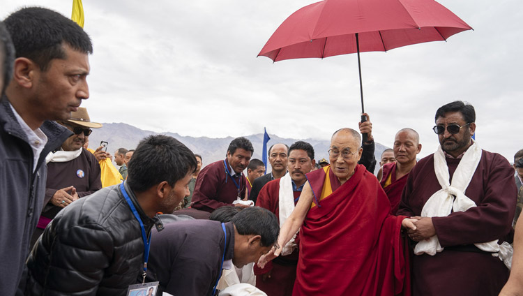 His Holiness the Dalai Lama being escorted to his motorcade on arrival at the helipad in Padum, Zanskar, J&K, India on July 21, 2018. Photo by Tenzin Choejor