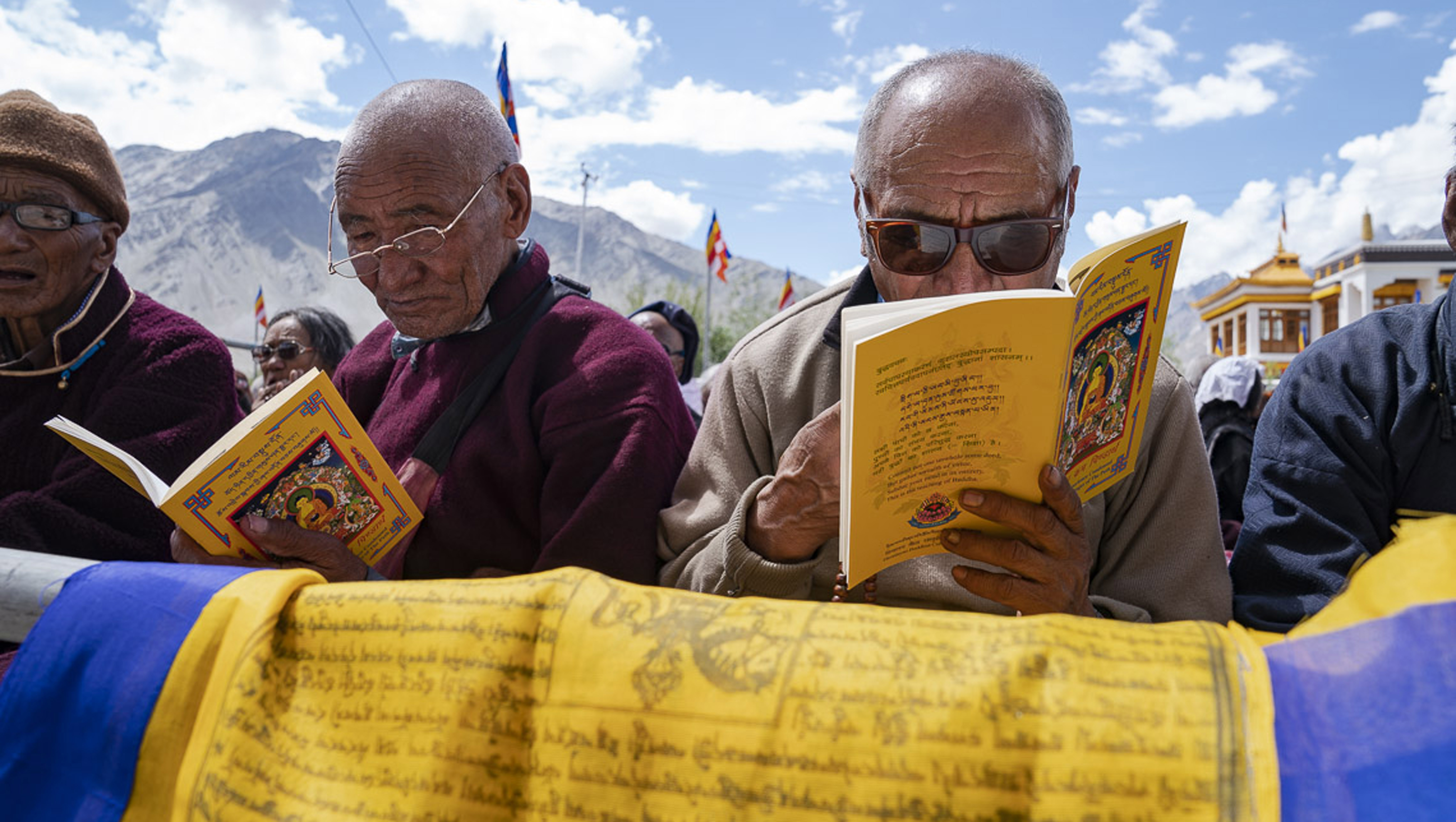 Members of the audience following the text during His Holiness the Dalai Lama's teaching in Padum, Zanskar, J&K, India on July 22, 2018. Photo by Tenzin Choejor