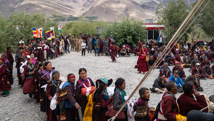 Residents of Zanskar lined up with offerings during the Long-Life Offering ceremony for His Holiness the Dalai Lama in Padum, Zanskar, J&K, India on July 23, 2018. Photo by Tenzin Choejor