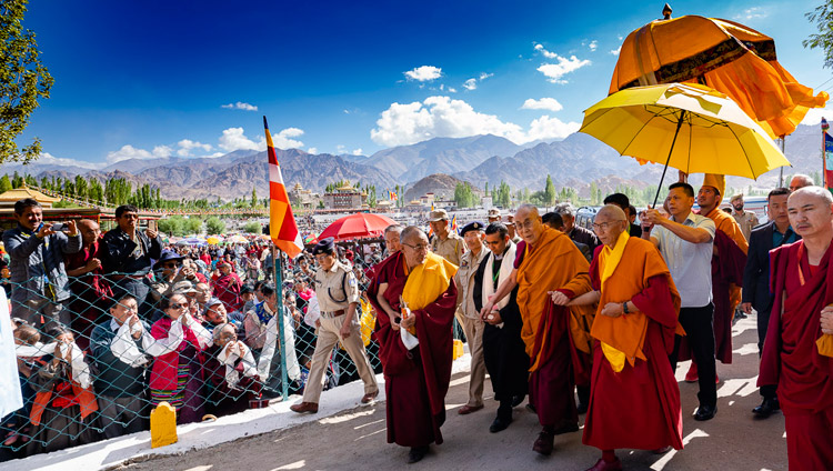 His Holiness the Dalai Lama walking from his residence to the Shewatsel Teaching Ground on the first day of his two day teaching in Leh, Ladakh, J&K, India on July 30, 2018. Photo by Tenzin Choejor