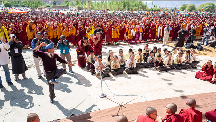 Students from Ladakh Public School demonstrating philosophical debate as His Holiness the Dalai Lama arrives at the Shewatsel Teaching Ground on the first day of his two day teaching in Leh, Ladakh, J&K, India on July 30, 2018. Photo by Tenzin Choejor