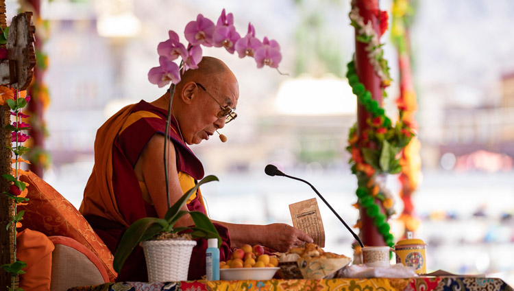 His Holiness the Dalai Lama reading from Shantideva's "Guide to a Bodhisattva's Way of Life" on the first day of his two day teaching in Leh, Ladakh, J&K, India on July 30, 2018. Photo by Tenzin Choejor