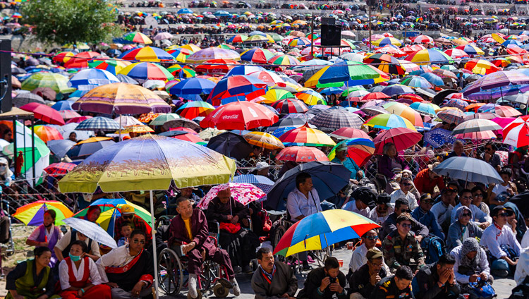 Most of the estimated 30,000 people attending the final day of His Holiness the Dalai Lama's teachings protecting themselves from the sun under umbrellas at the Shewatsel Teaching Ground in Leh, Ladakh, J&K, India on July 31, 2018. Photo by Tenzin Choejor