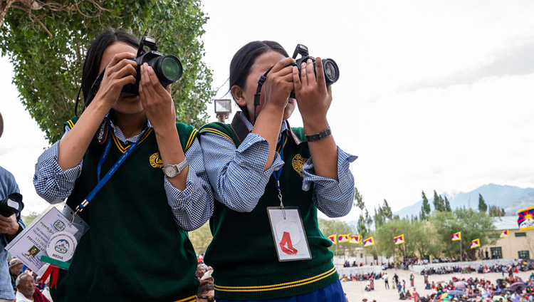 Members of the TCV Photography Club taking photos during His Holiness the Dalai Lama's talk at Tibetan Children’s Village School Choglamsar in Leh, Ladakh, J&K, India on August 1, 2018. Photo by Tenzin Choejor