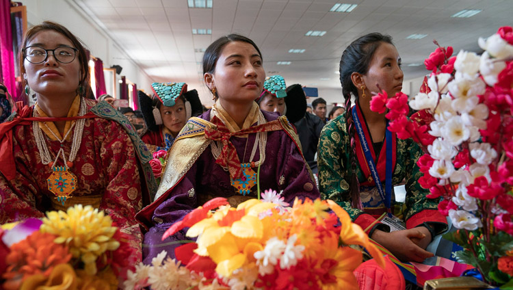 Some of the more than 1500 students, many in traditional dress, watching as HIs Holiness the Dalai Lama arrives on stage at Eliezer Joldan Memorial College in Leh, Ladakh, J&K, India on August 2, 2018. Photo by Tenzin Choejor