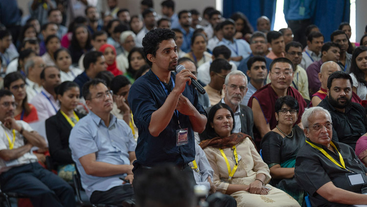 A member of the audience asking His Holiness the Dalai Lama a question during his talk at the Goa Institute of Management in Sanquelim, Goa, India on August 8, 2018. Photo by Tenzin Choejor A member of the audience asking His Holiness the Dalai Lama a question during his talk at the Goa Institute of Management in Sanquelim, Goa, India on August 8, 2018. Photo by Tenzin Choejor