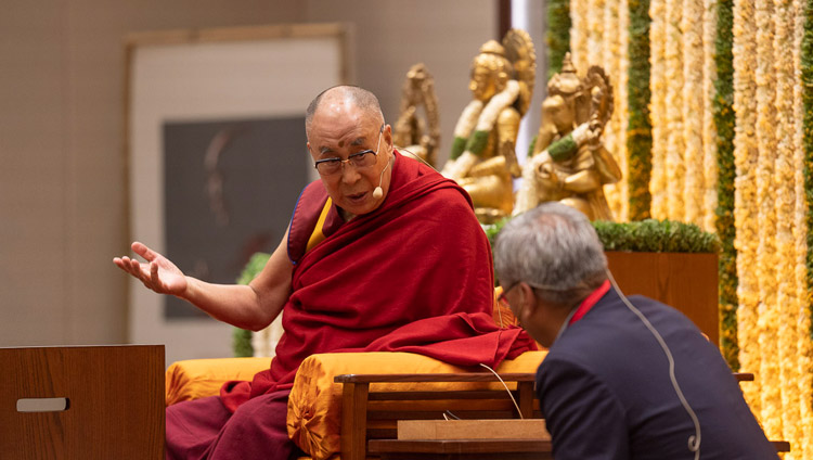 His Holiness the Dalai Lama explaining a point in Tibetan to his English language interpreter during his talk on 'Indian Wisdom and the Modern World' in Bengaluru, Karnataka, India on August 12, 2018. Photo by Tenzin Choejor