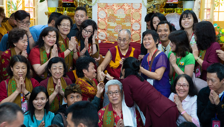 His Holiness the Dalai Lama posing for one of many group photos with members of the audience from East and Southeast Asia at the conclusion of his teachings at the Main Tibetan Temple in Dharamsala, HP, India on September 7, 2018. Photo by Tenzin Choejor