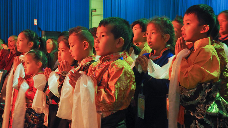 A group of young children singing a prayer for the long life of His Holiness the Dalai Lama at the start of his meeting with members of the Tibetan community at the Ahoy convention centre in Rotterdam, Netherlands on September 16, 2018. Photo by Jeremy Russell