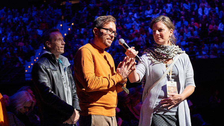 A member of the audience asking His Holiness the Dalai Lama a question during his talk at the Ahoy convention centre in Rotterdam, Netherlands on September 16, 2018. Photo by Olivier Adams