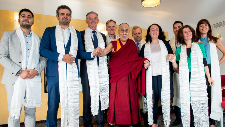 Dutch Parliamentarians wearing traditional white scarves presented by His Holiness the Dalai Lama after their meeting in Rotterdam, the Netherlands on September 17, 2018. Photo by Jurjen Donkers