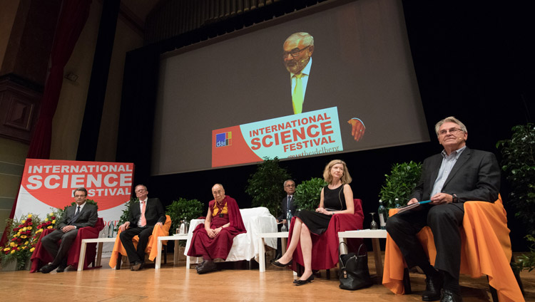 His Holiness the Dalai Lama and fellow panelists listening to Mayor Wolfgang Erichson deliver his welcoming speech at the start of the dialogue on Happiness and Responsibility in Heidelberg, Germany on September 20, 2018. Photo by Manuel Bauer