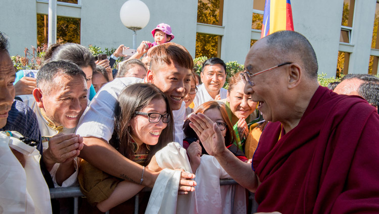 His Holiness the Dalai Lama interacting with members of the Tibetan community gathered at his hotel to welcome him on his arrival in Zurich, Switzerland on September 20, 2018. Photo by Manuel Bauer