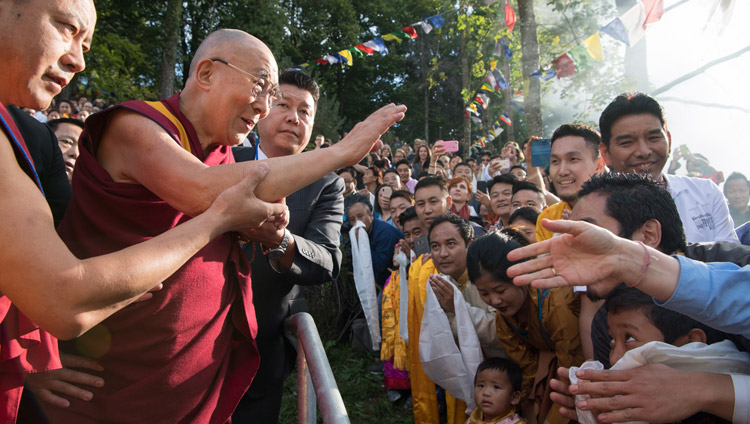 His Holiness the Dalai Lama waving to the crowd of Tibetans gathered to welcome him to Tibet Institute Rikon in Rikon, Switzerland on September 21, 2018. Photo by Manuel Bauer