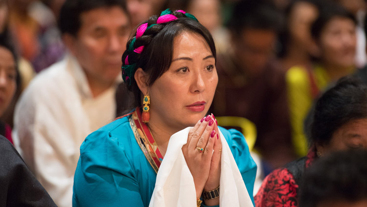 A member of the audience of more than 6,000 Tibetans and Tibet supporters, listening the His Holiness the Dalai Lama during their meeting at the Zurich Hallenstadion in Zurich, Switzerland on September 23, 2018. Photo by Manuel Bauer